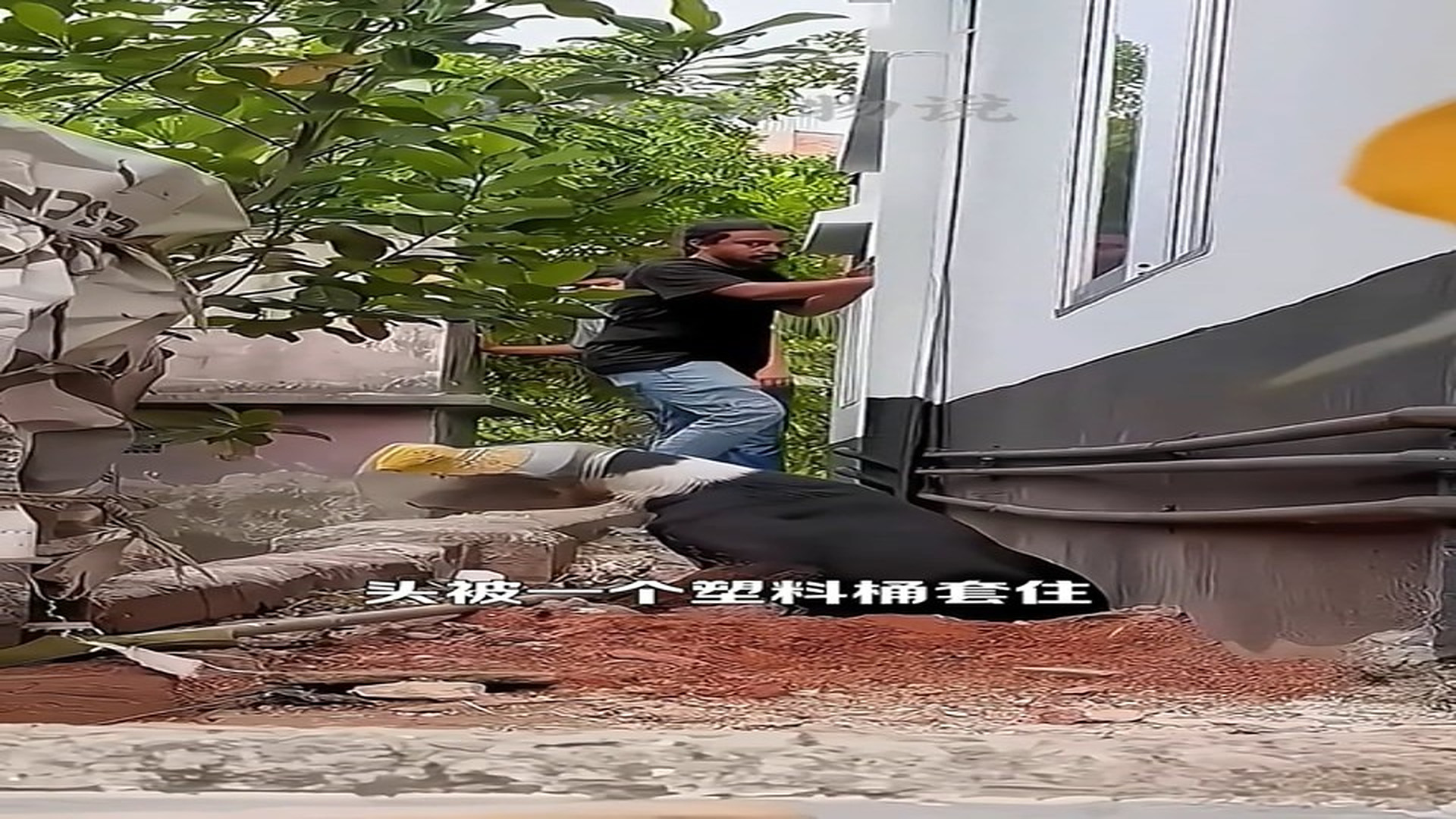 Full story: T2606037_A stray dog accidentally got its head stuck in a plastic bucket, and the man went to great lengths to help it